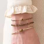 A Beautiful Story - Iris rannekoru Tiger Eye, gold
