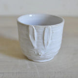 Pupumuki pieni, White