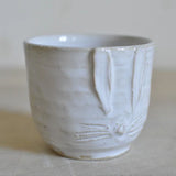 Pupumuki pieni, White